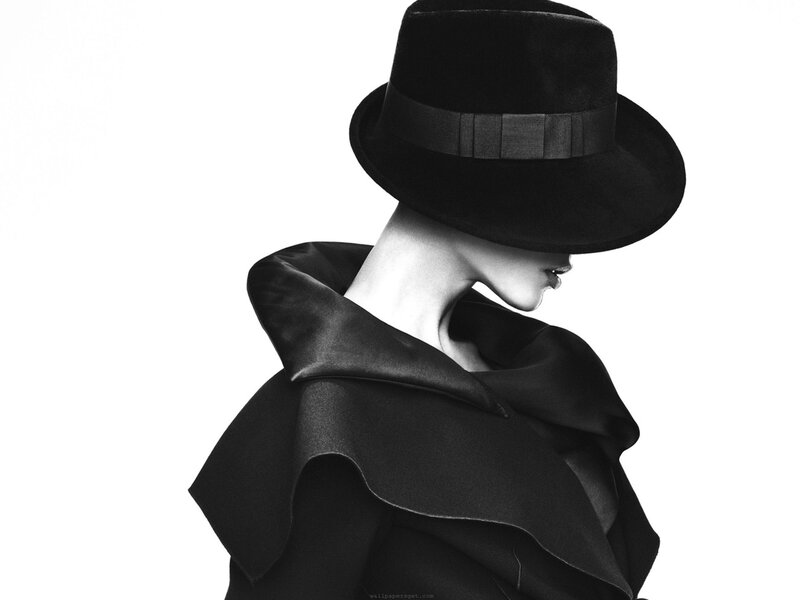 woman in black hat and coat
