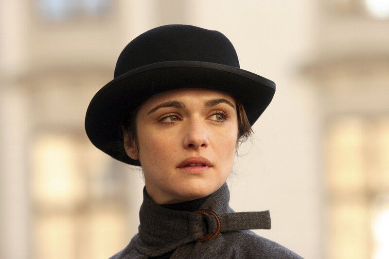woman in black hat and coat