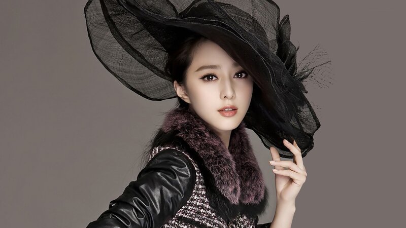 woman in black hat and fur coat