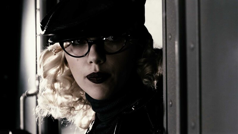 woman in black hat and glasses