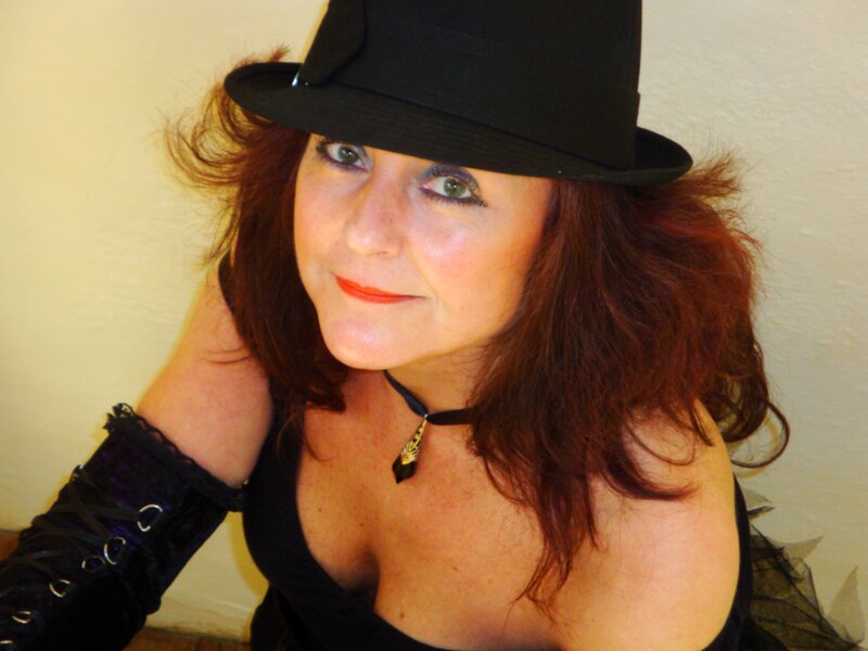 woman in black hat and gloves