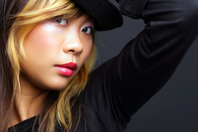 woman in black hat and jacket