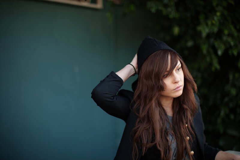 woman in black hat and jacket