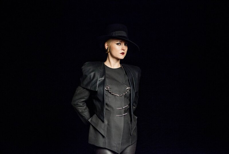 woman in black hat and jacket