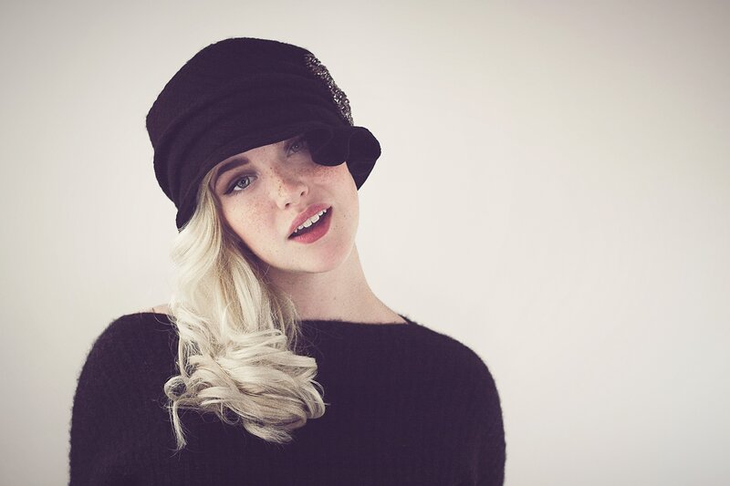 woman in black hat and sweater