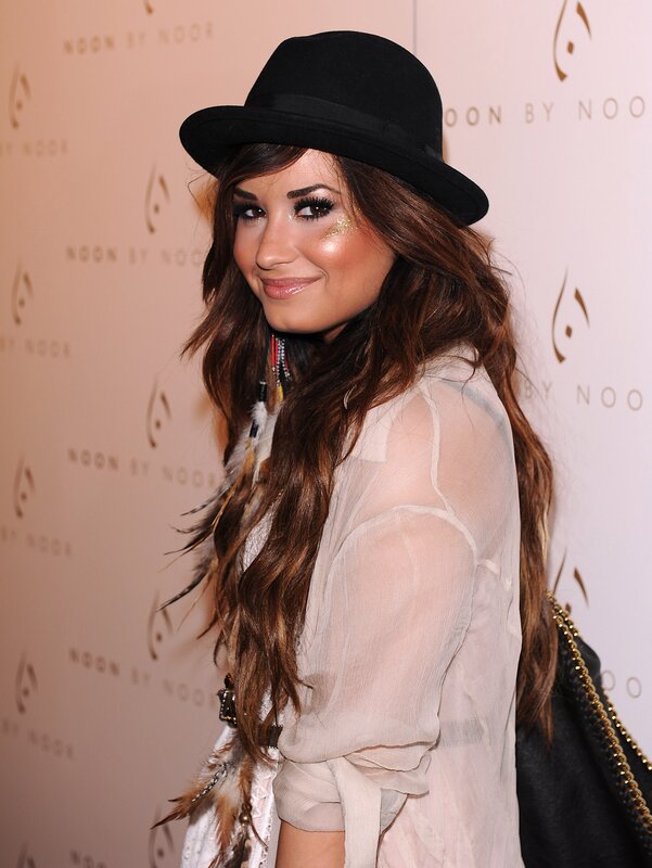 woman in black hat at event