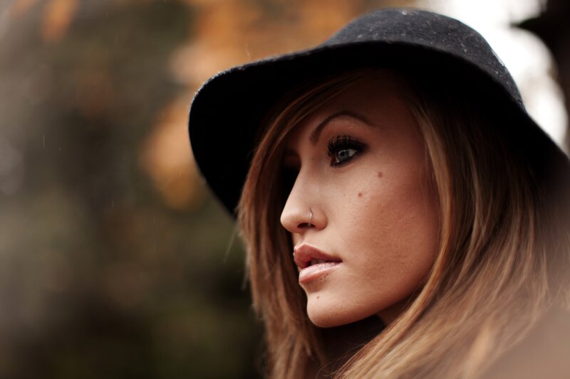 Woman in Black Hat — Brown, Contemplative, Autumn