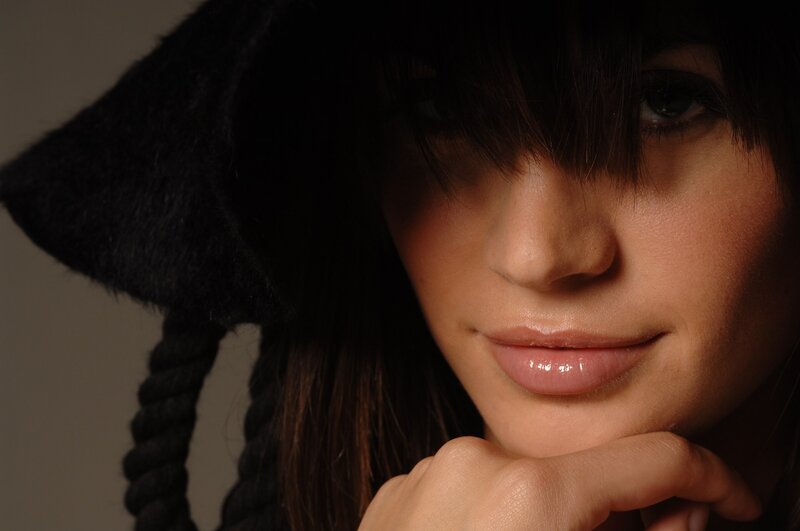 woman in black hat close-up
