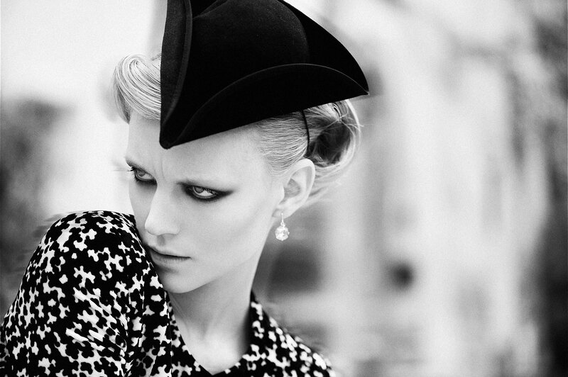 Woman in Black Hat — Dramatic, Photograph, Earring, Patterned Top