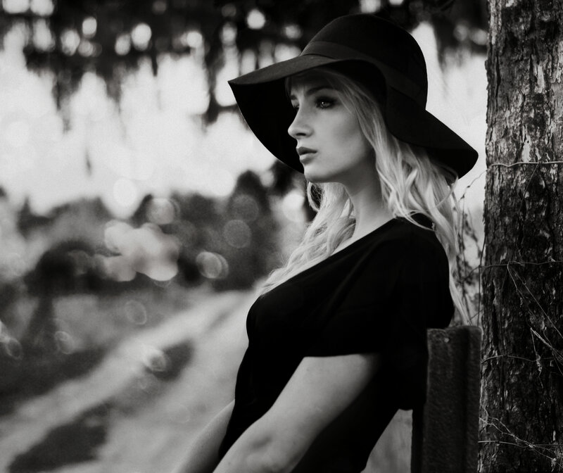 Woman in Black Hat — Dramatic, Photograph, Tree