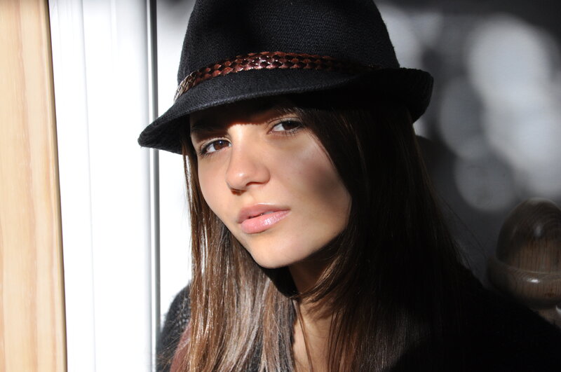 woman in black hat portrait