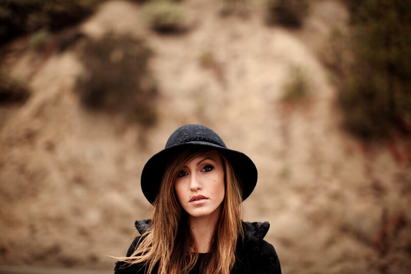 woman in black hat portrait
