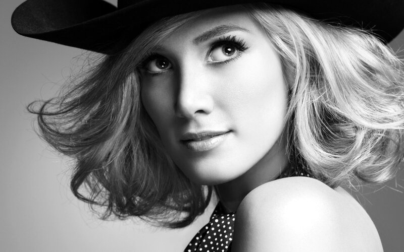 woman in black hat portrait