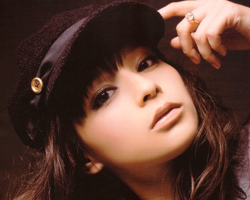 woman in black hat portrait