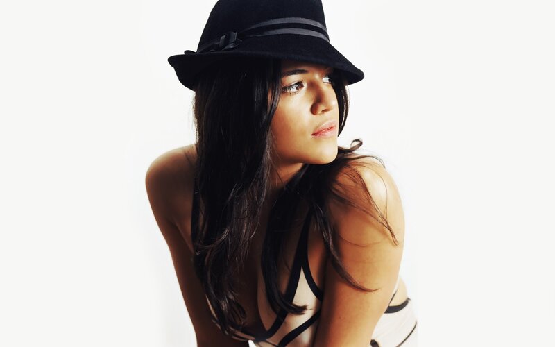 woman in black hat posing