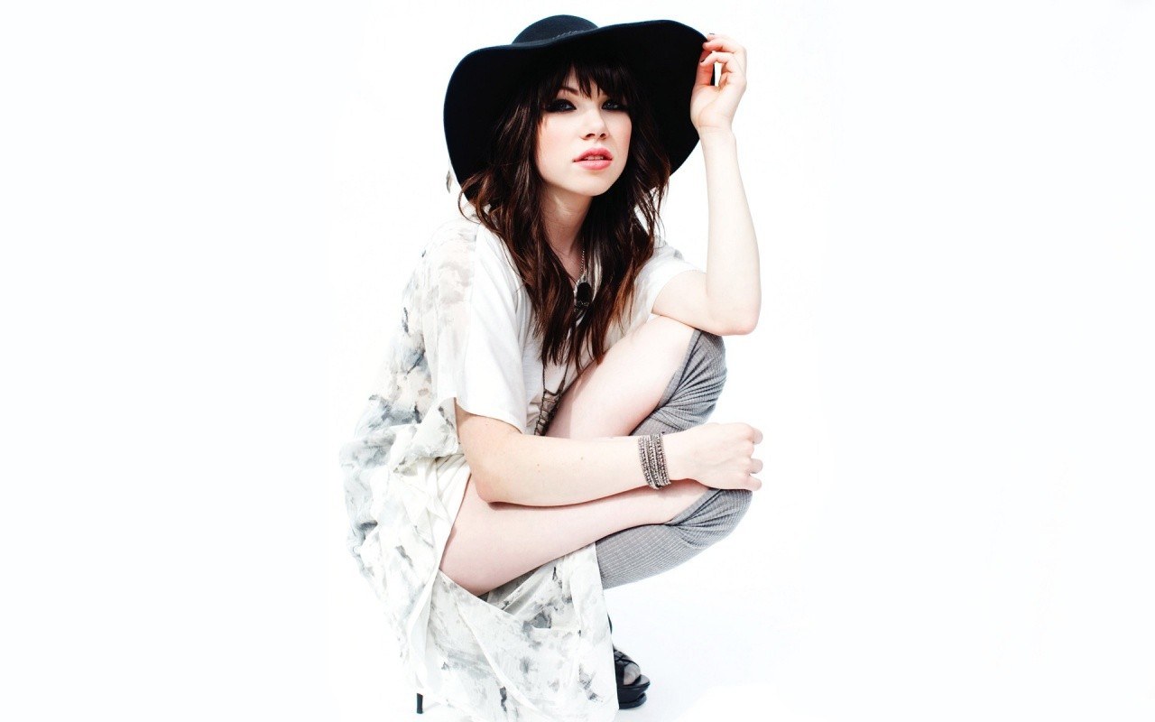 woman in black hat posing