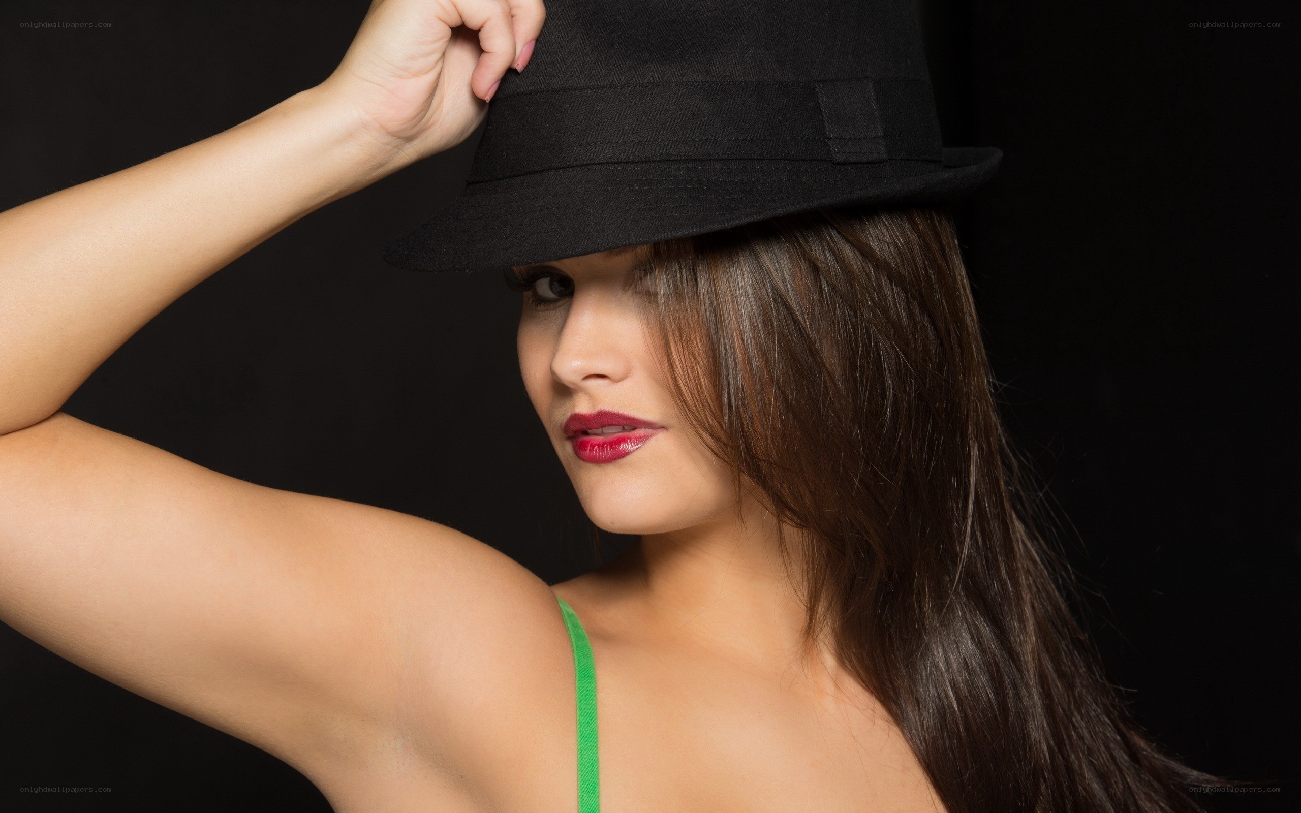 woman in black hat posing