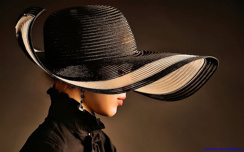 woman in black hat profile