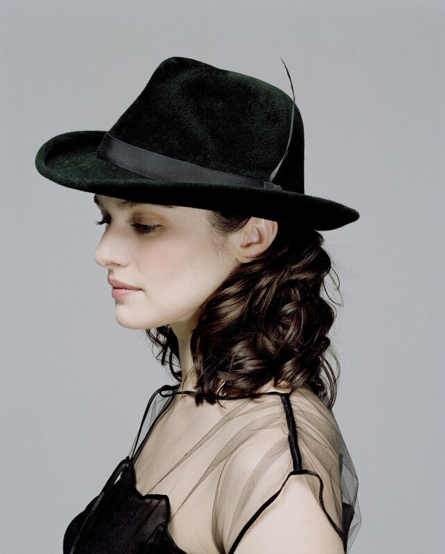 woman in black hat profile