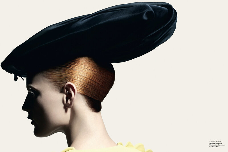 woman in black hat profile