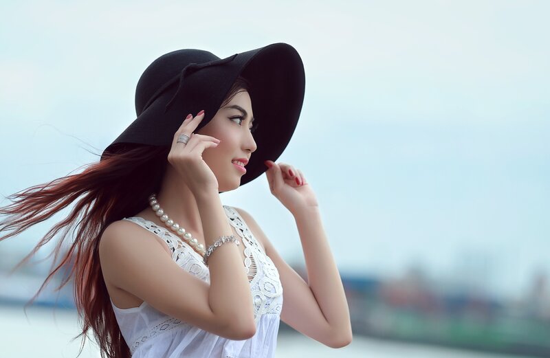 Woman in Black Hat — Serene, Afternoon, Photograph
