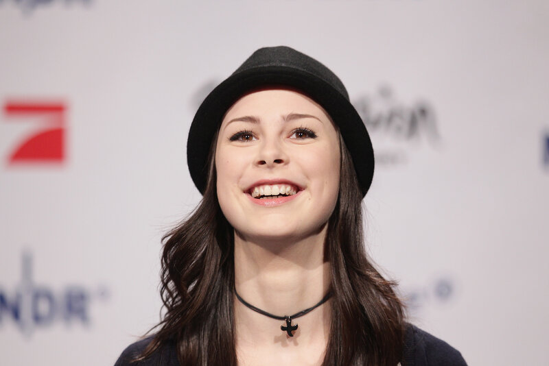 woman in black hat smiling