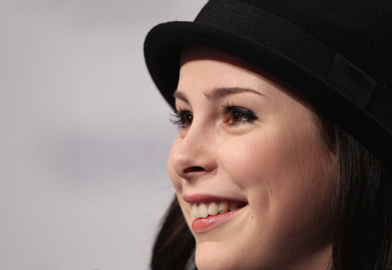 woman in black hat smiling