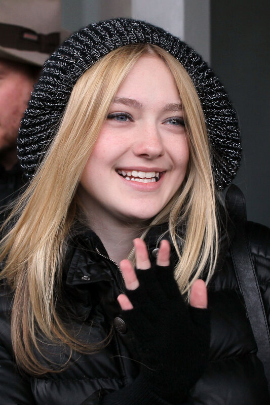 woman in black hat smiling