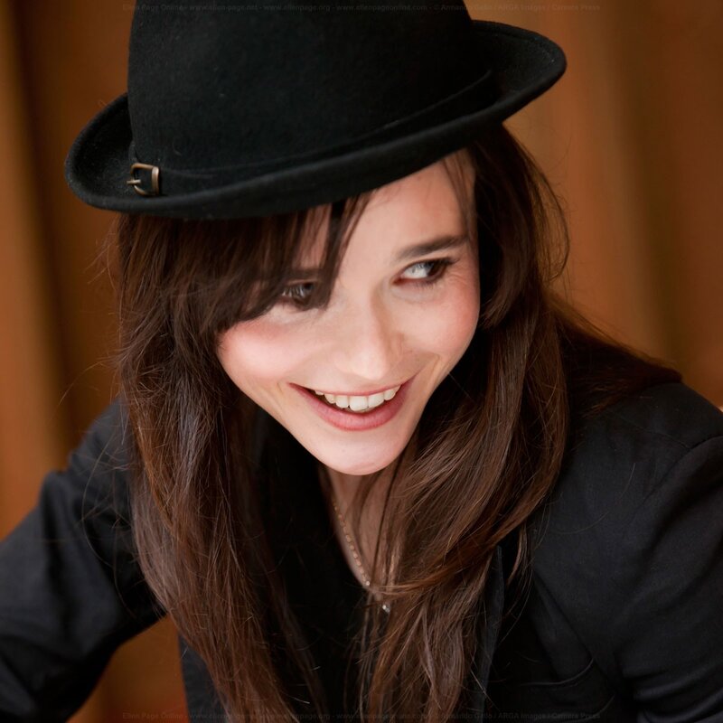woman in black hat smiling
