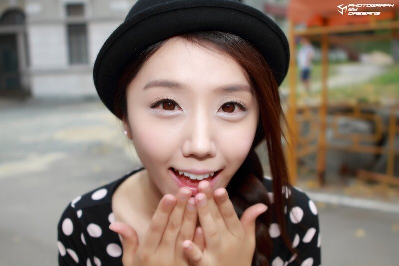 woman in black hat smiling