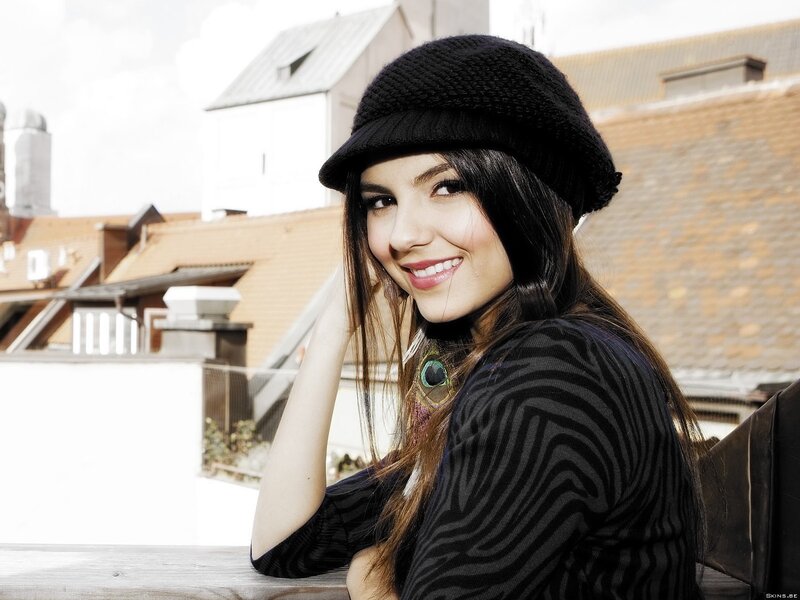 woman in black hat smiling