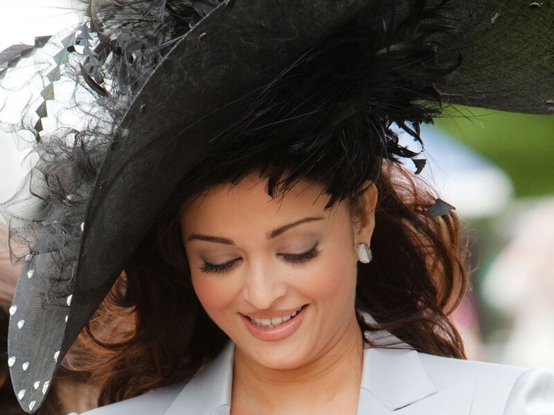 woman in black hat smiling
