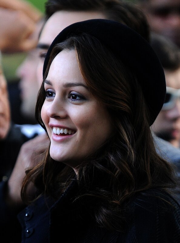 woman in black hat smiling