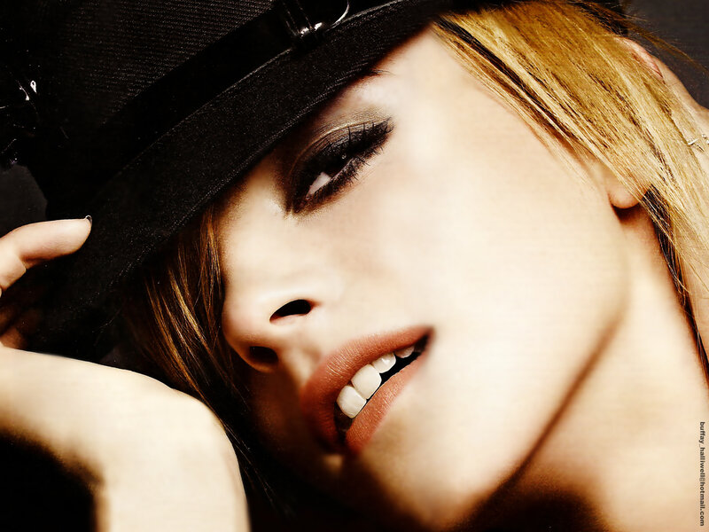 woman in black hat smiling