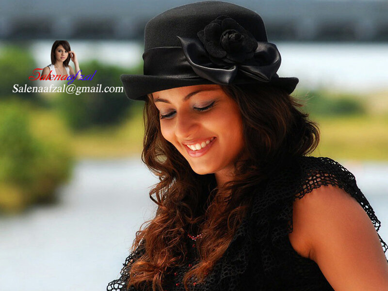 woman in black hat smiling