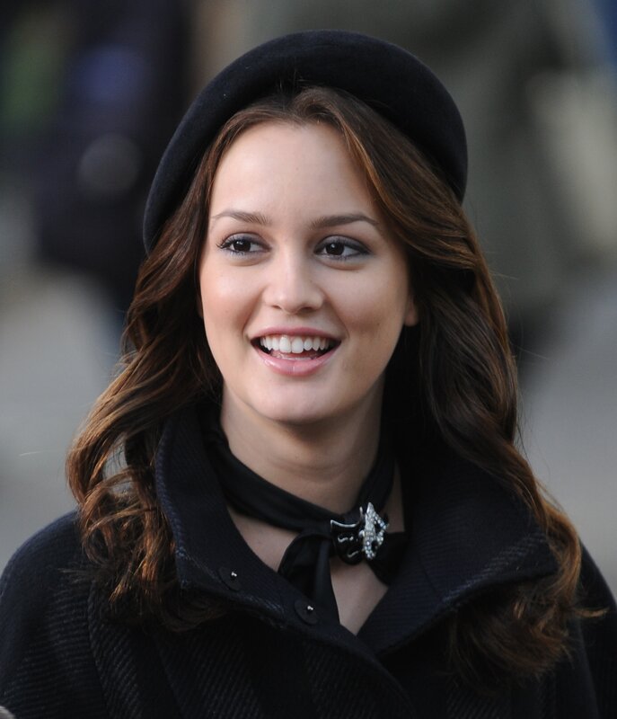 woman in black hat smiling