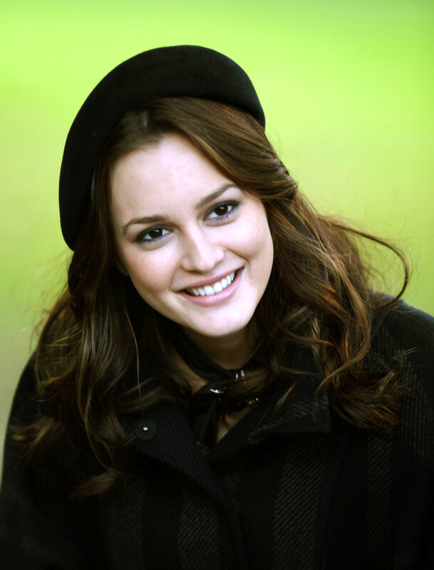 woman in black hat smiling