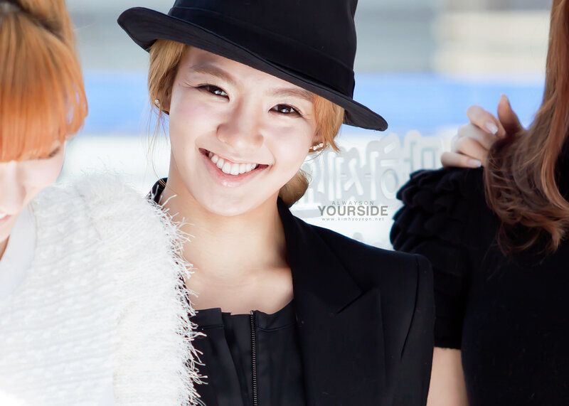 woman in black hat smiling