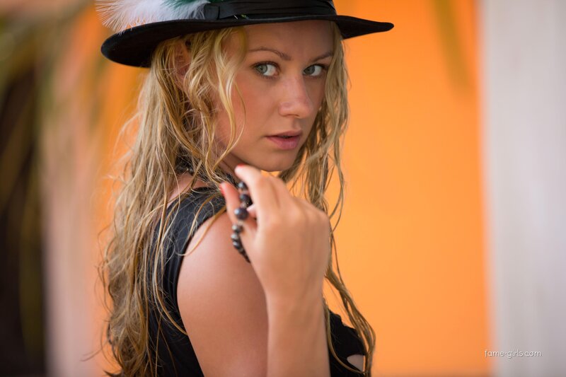 woman in black hat with beads
