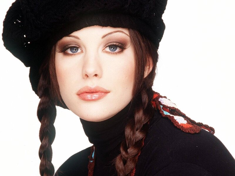 woman in black hat with braids