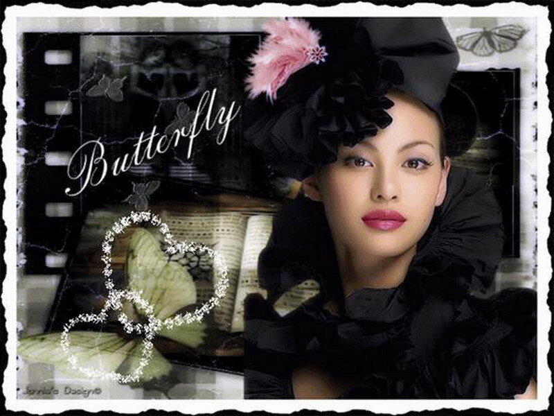 Woman in black hat with butterfly