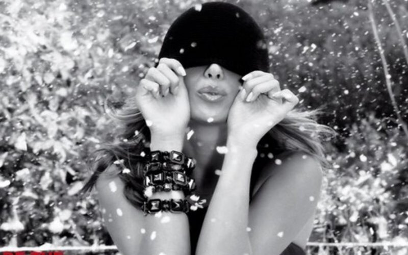 woman in black hat with snow