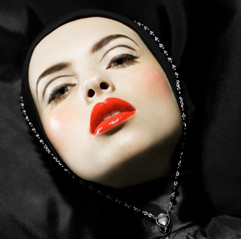woman in black headscarf with red lips