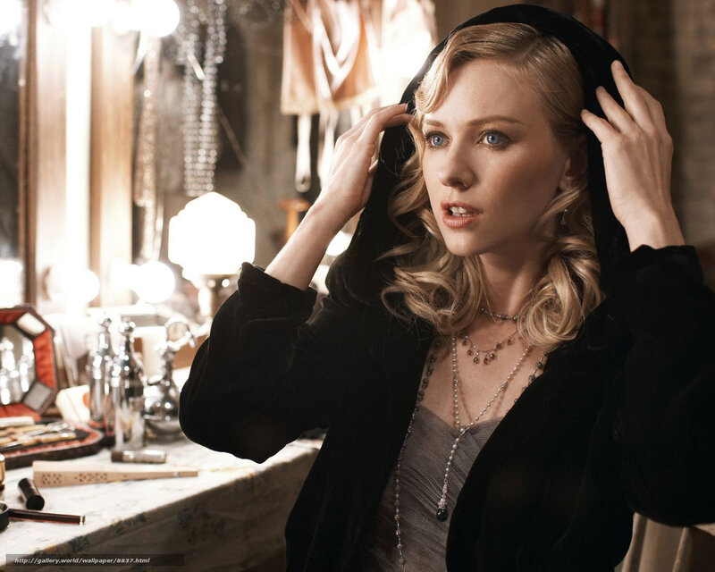 woman in black hood adjusting hair