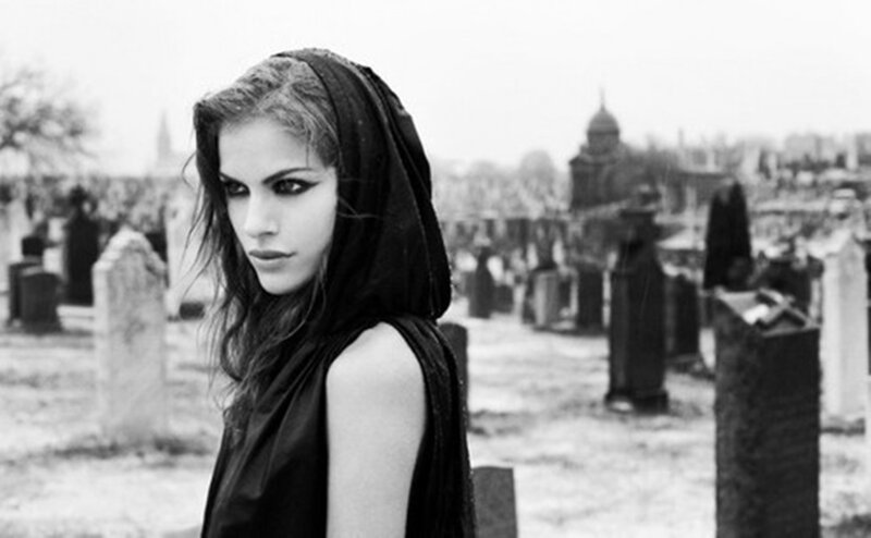 Woman in Black Hood — Somber