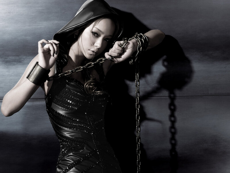 woman in black hood with chains