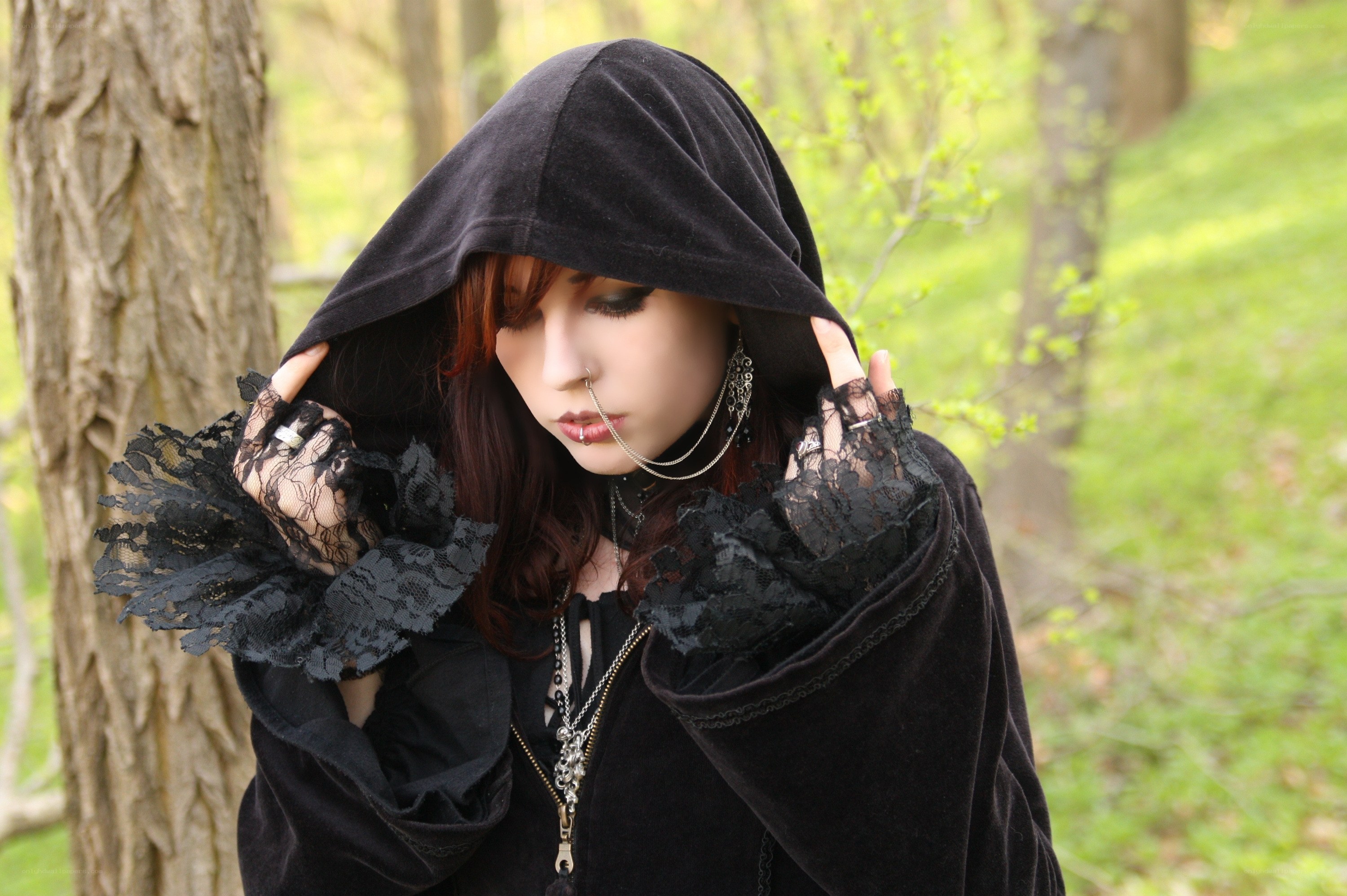 woman in black hooded cloak