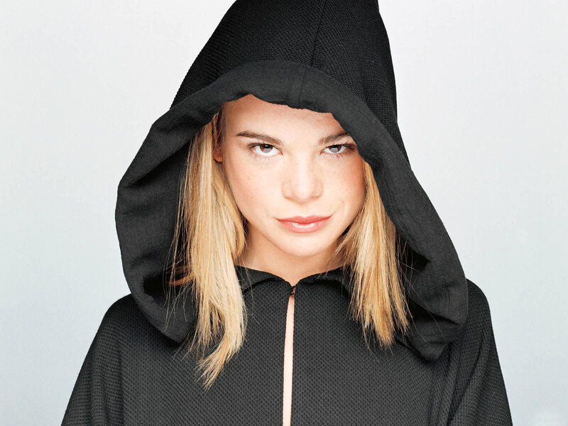 woman in black hooded garment