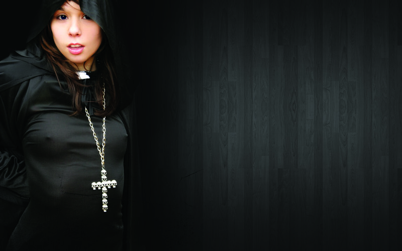 woman in black hooded robe