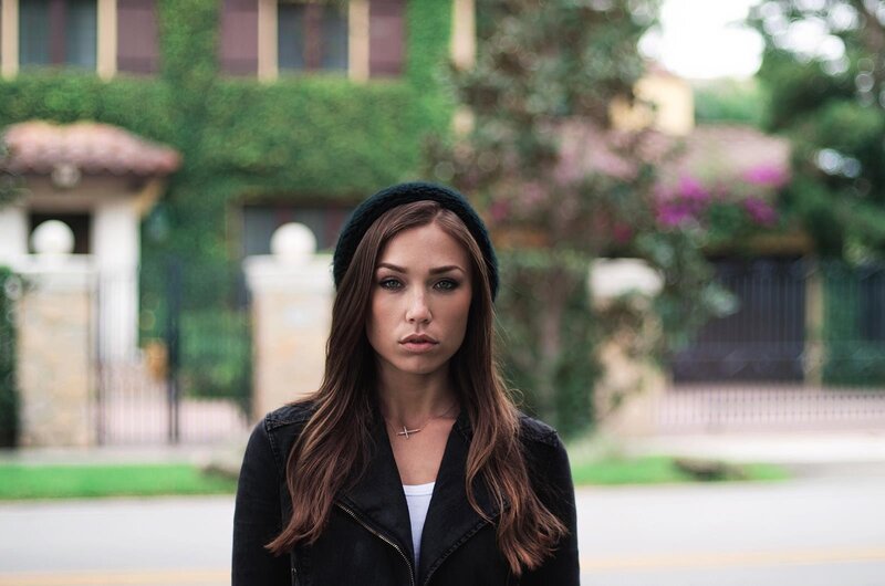 woman in black jacket and beanie